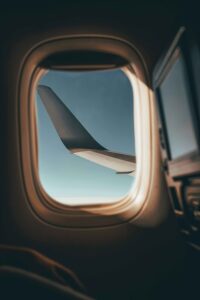 View of an airplane wing from the window of a business jet.